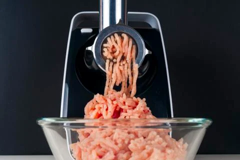 Mincing machine and meat. preparation of minced raw meat Stock Photos