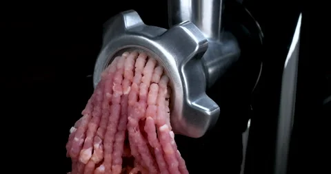 Mincing machine with fresh meat on black background Stock Footage 231989826