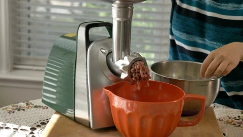 Mincing meat with meat grinder Stock Footage 117863802