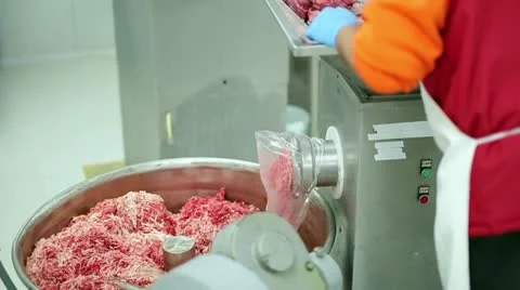 Mincing meat in meat machine Stock Footage 23338590