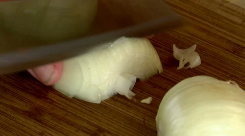 Mincing onions with a kitchen knife Stock Footage 55875505