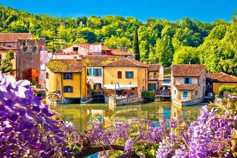 Mincio river and idyllic village of Borghetto view Mincio river and idylli... Stock Photos