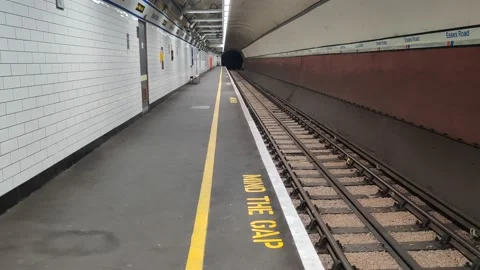 MIND THE GAP Empty Central Lonodn Tube Station during Covid-19, 4K Stock Footage 139889352