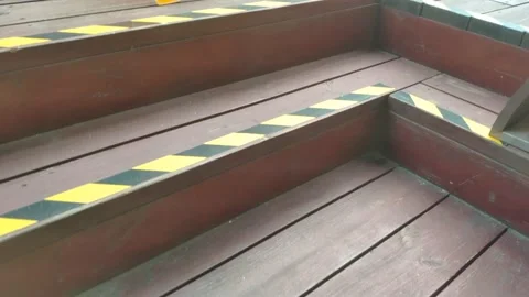 Mind your step wet floor sign in Chinese on an outside wooden terrace, China Stock Footage 160448341