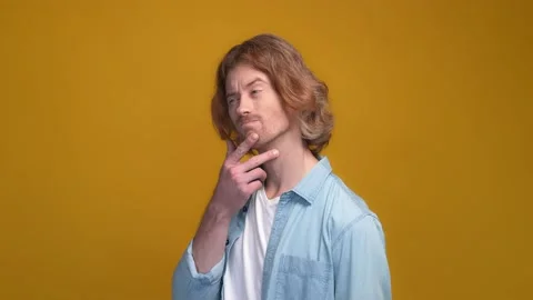 Minded interested guy consider thoughts unsure isolated shine color background Video stock 169277340