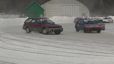 Minden, Canada Jan 12 2026 Ice Racing Cars Drifting on Frozen Track in Winter Stock Footage 346398624