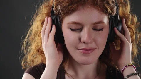 Mindfulness And Relaxation Concept, Young Woman With Red Curly Hair Listening To Stock Footage 335931889