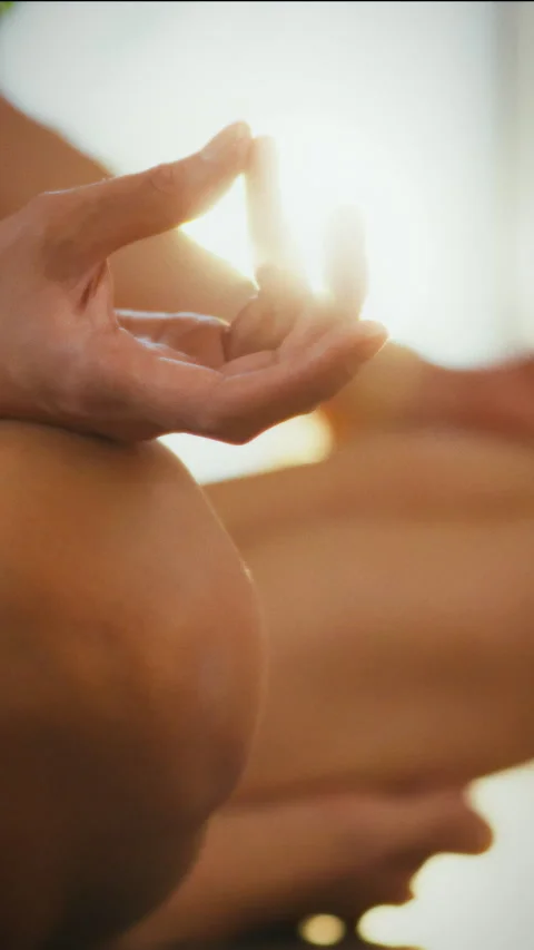 Mindfulness meditation practice in a bright indoor space for relaxation and Stock Footage 331666598