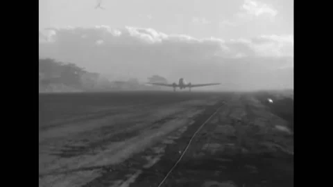 MINDORO - 1945 - A C-47 plane taxis on a runway on Mindoro Island, Philippines. Stock Footage 264753160