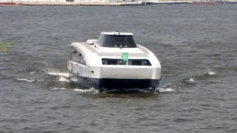 The MINE Electric Smart Ferry sails along the Chao Phraya River in Bangkok Stock Footage 240220094