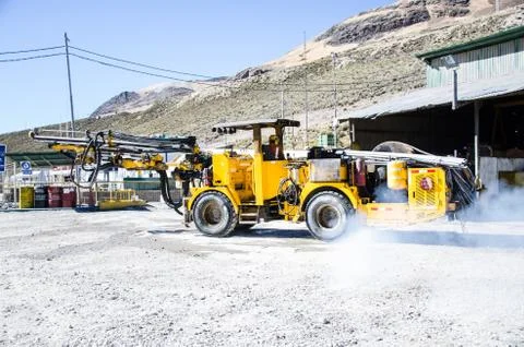 Mine machine heading to the cave for work Stock Photos