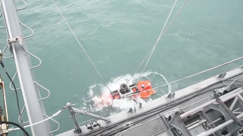 Mine Neutralization Vehicle being lowered into sea from USS Chief Stock Footage 86894088
