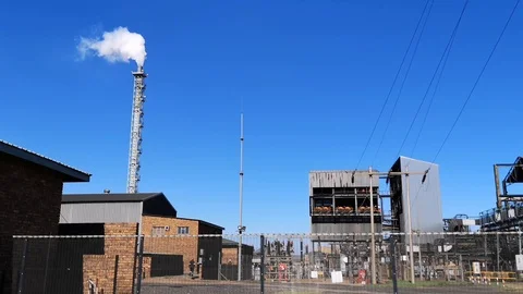 Mine ore processing plant, smoke coming from chimney stack Stock Footage 108440373