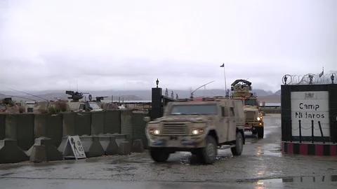 Mine resistant ambush protected vehicles MRAP's leaving Camp Marmal Afghanistan Stock Footage 92525005