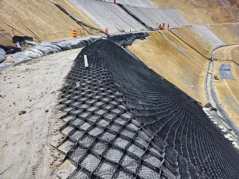 Mine slope stabilization process with geosynthetics and shotcrete Stock Photos