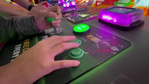Minecraft Dungeons Video Game. Small hands Using Joystick And Buttons To Stock Footage 221784063