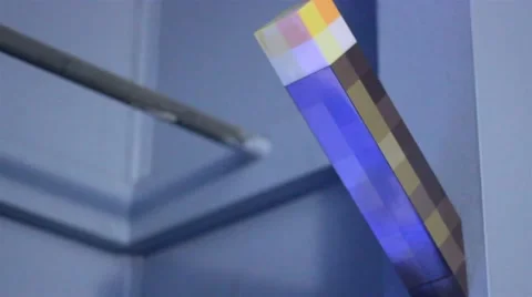 Minecraft torch toy on blue wall Stock Footage 47465665