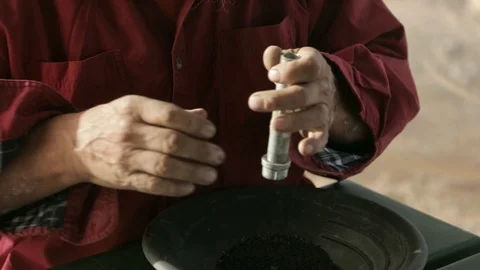 Miner assembling pipe bomb Stock Footage 102629193