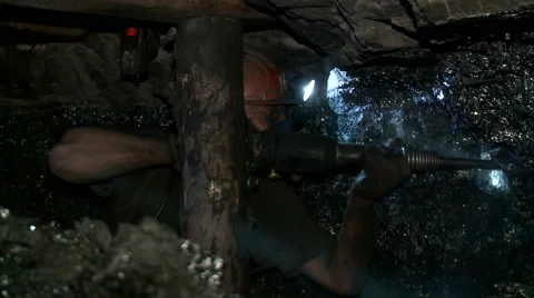 Miner extracts coal in the dark in this mine Stock Footage 68189091