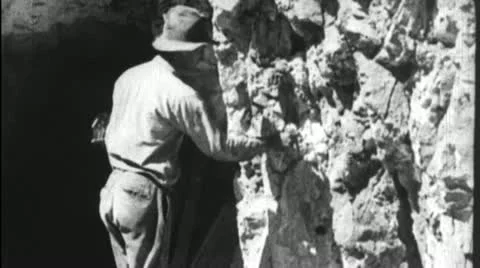 Miner LIGHTING DYNAMITE FUSE Mining Ore Blast Vintage Film Industrial Movie 3651 Stock Footage