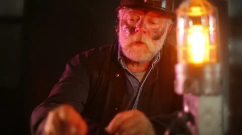 Miner looking at gem in mine Stock Footage 39120717