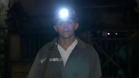 Miner looks at the camera before going down to the mine Stock Footage 132429731