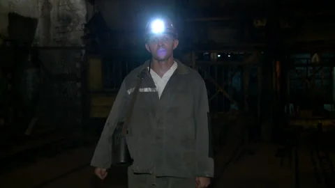Miner looks at the camera before going down to the mine Stock Footage 132431206