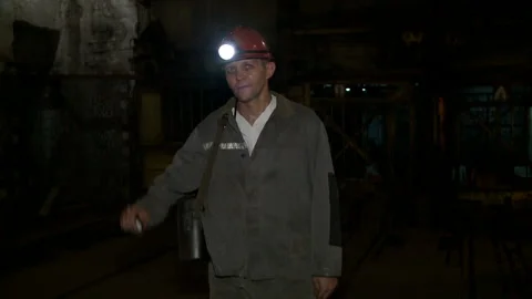 Miner looks at the camera before going down to the mine Stock Footage 132432121