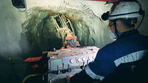 Miner is operating an irrigation machine inside of the mine 動画素材 158355907