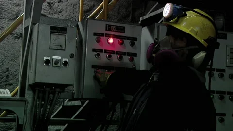 Miner Operating Underground Control Panel at Iron Ore Mine, Sierra Grande - 4K 動画素材 229353463