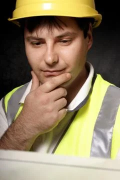 Miner reading a map Stock Photos