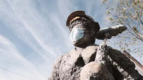 Miner statue wearing a facemask Stock Footage 156062325