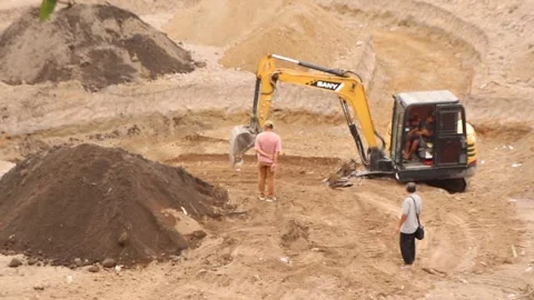 Miner workers digging the ground with a bulldozer Stock Footage 291595540