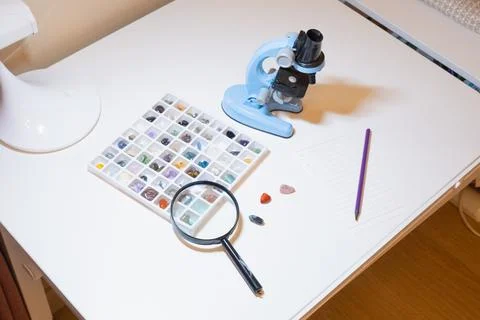 Mineral And Stone Collection With Microscope For Study Stock Photos