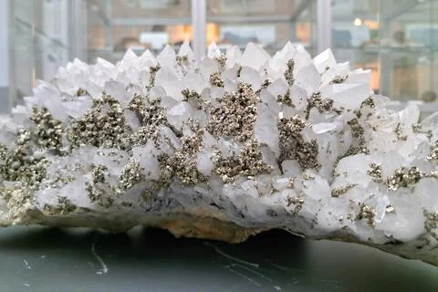 A mineral specimen featuring clusters of clear, pointed quartz crystals with  Stock Photos