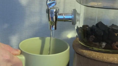 Mineral Water Level Dropping While Pouring, Concept of Purity and Healthy Stock Footage 348211796