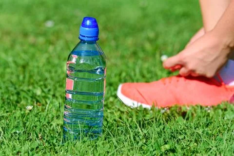 Mineral water while jogging Stock Photos