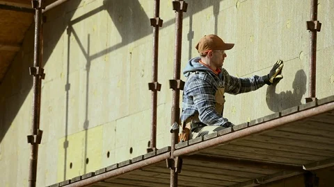 Mineral Wool Blocks on House Wall. Exterior Walls Insulating Process. Stock Footage 124606731