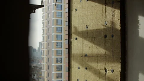 Mineral wool facade insulation fixed with anchors on building exterior Stock Footage 327063807