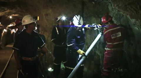 Miners and technicians working in mine Stock Footage 33448453