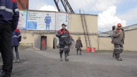 Miners out of the mine after completion of the work shift in Russia Stockbeeldmateriaal 74490468