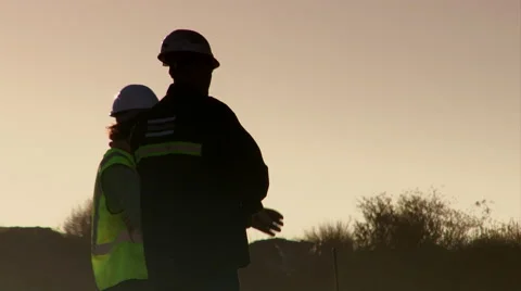 Miners silhouette talking Stock Footage 55038494