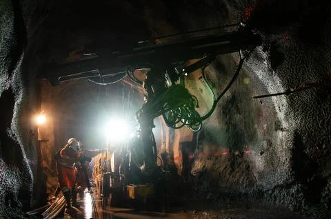 Miners at work in an underground tunnel Stock Photos