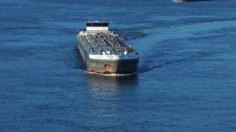 Minerva cargo ship sailing along the riverfront of historic Dordrecht Stock Footage 313603162