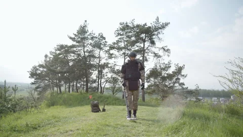 Minesweeper uses a mine detector, outdoors, advanced training for sappers Video stock 240499414