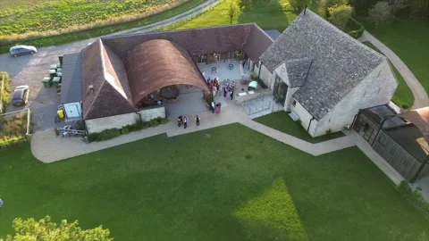 Mingling Wedding Party In Converted Barn In The Cotswolds, England Video stock 246327094