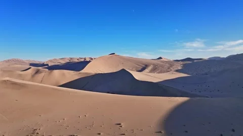 Mingsha Mountain and Crescent Spring at dusk, ​Dunhuang city Stock-Footage 324932908