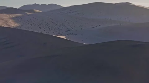 Mingsha Mountain and Crescent Spring at dusk, ​Dunhuang city Stock Footage 324933585