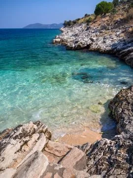 Mini beach and flip flops with a beautiful view on the island of Kefalonia in Stock Photos
