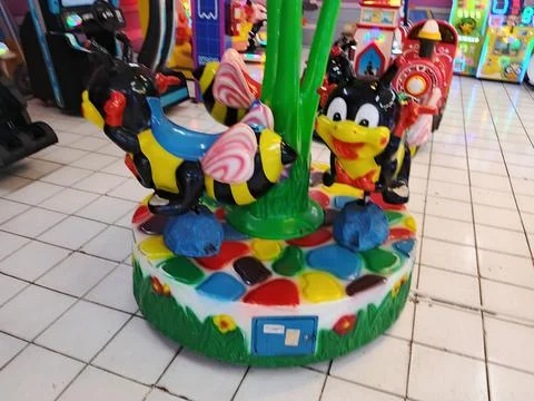Mini Bee Carousel Kiddy Ride at Indoor Children Amusement Center Stock Photos